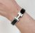 Hermès Clic Clac Bracelet Black enamel with white enamel H clasp