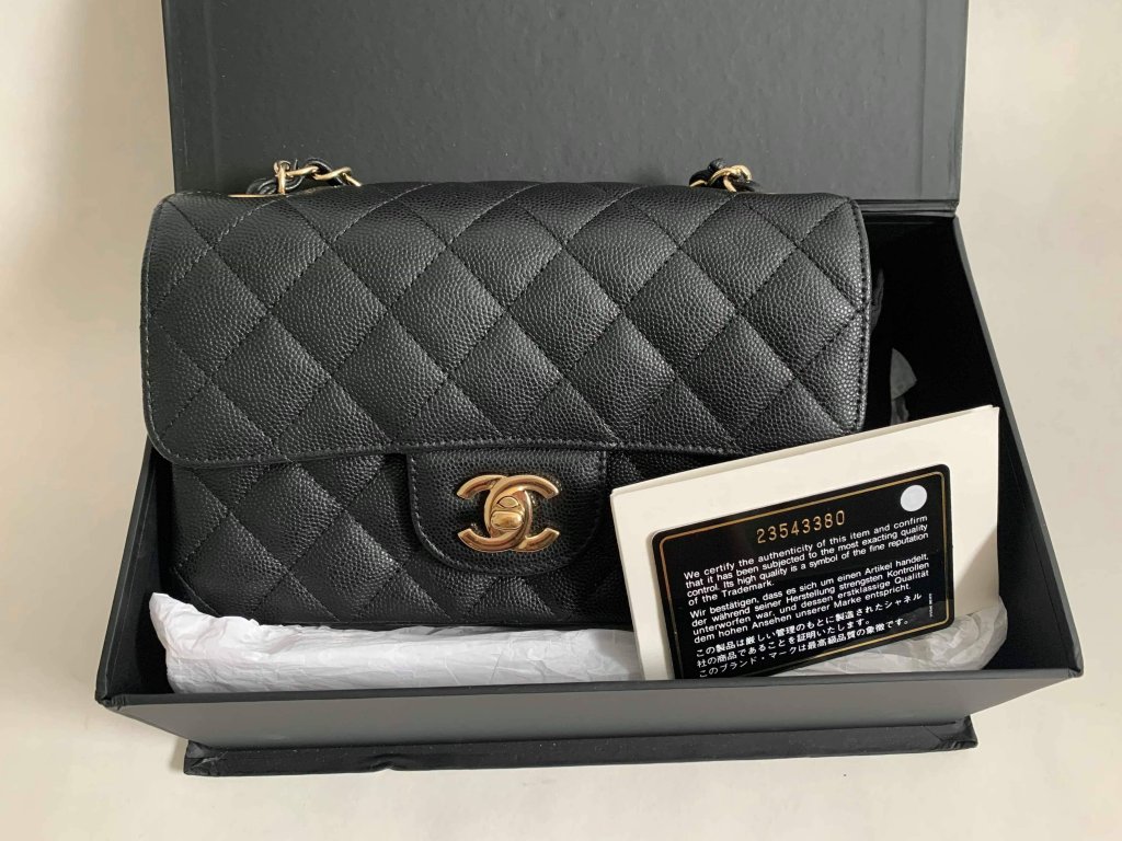 Chanel Classic mini 8” Black Caviar Leather and Light Gold Champagne  Hardware.